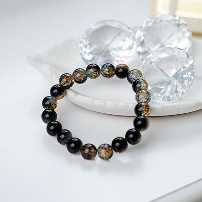 Tokassprādze "Stikla dziļums" melna zelta